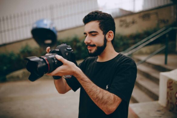 photographer holding a dslr camera